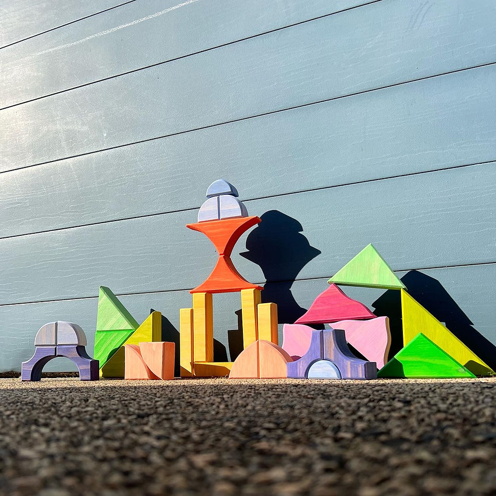 Thumbnail: Colorful wooden blocks arranged on a surface creating a playful city scene Serenitoys.