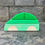 Thumbnail: Green wooden toy car with Serenitoys Triangles - Frosted on stone steps background.