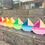 Thumbnail: Colorful wooden toy boats line a staircase, showcasing vibrant designs and craftsmanship.