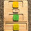 Thumbnail: Wooden puzzle board with yellow, green, and beige letter blocks; V, G, YG.