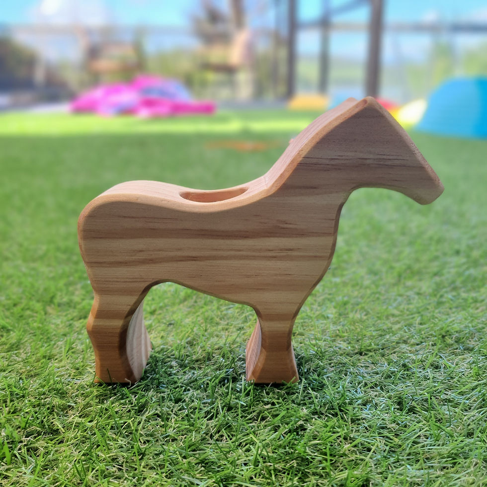 Thumbnail: Wooden horse toy on green grass. Serenitoys horse toy for children.