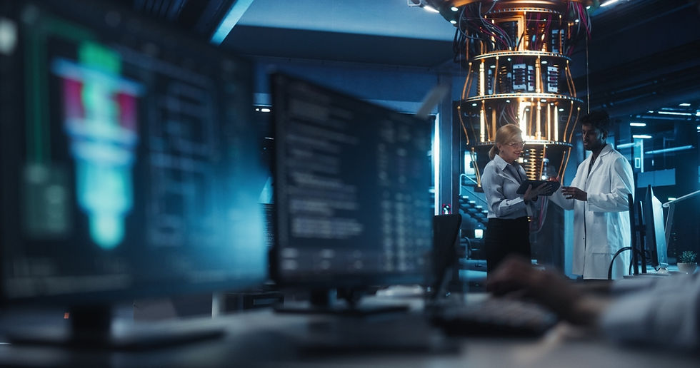 Technology analyst working at a computer workstation inside a blue-lit server room