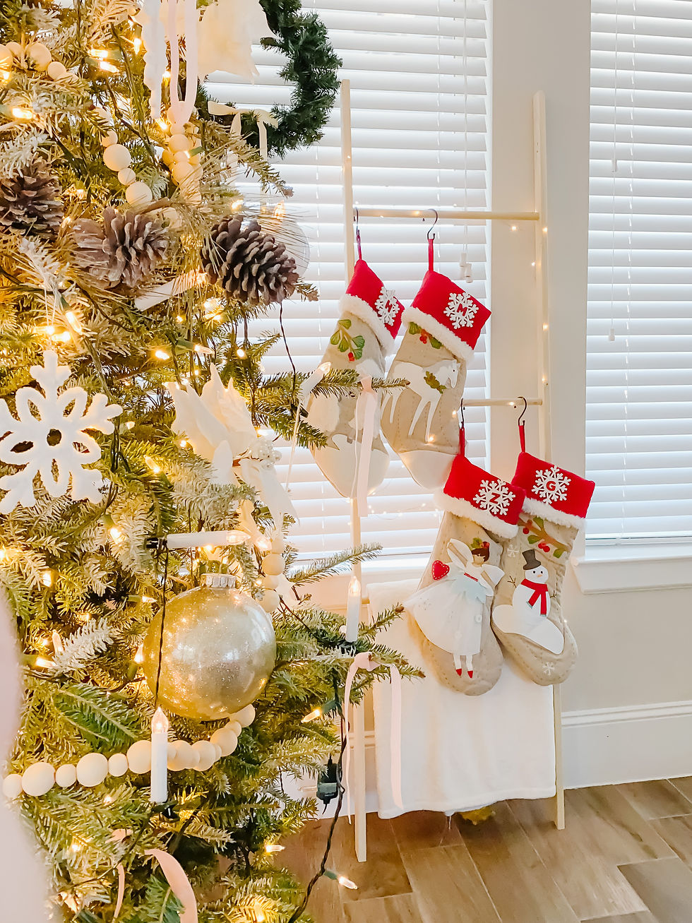 Wood ladder as home decor. Blanket ladder for Christmas stockings. Red and tan Christmas stockings. Classic Christmas stockings