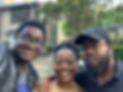 Austin with his mom Natasha (center) and brother Byron (right) in front of an apartment building