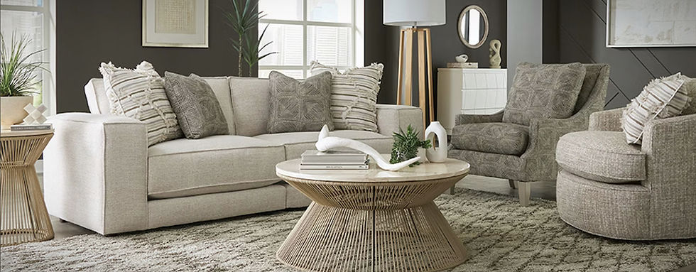 Living room with beige sofa, chairs, and marble table; interior design services. Pompano Furniture and Design