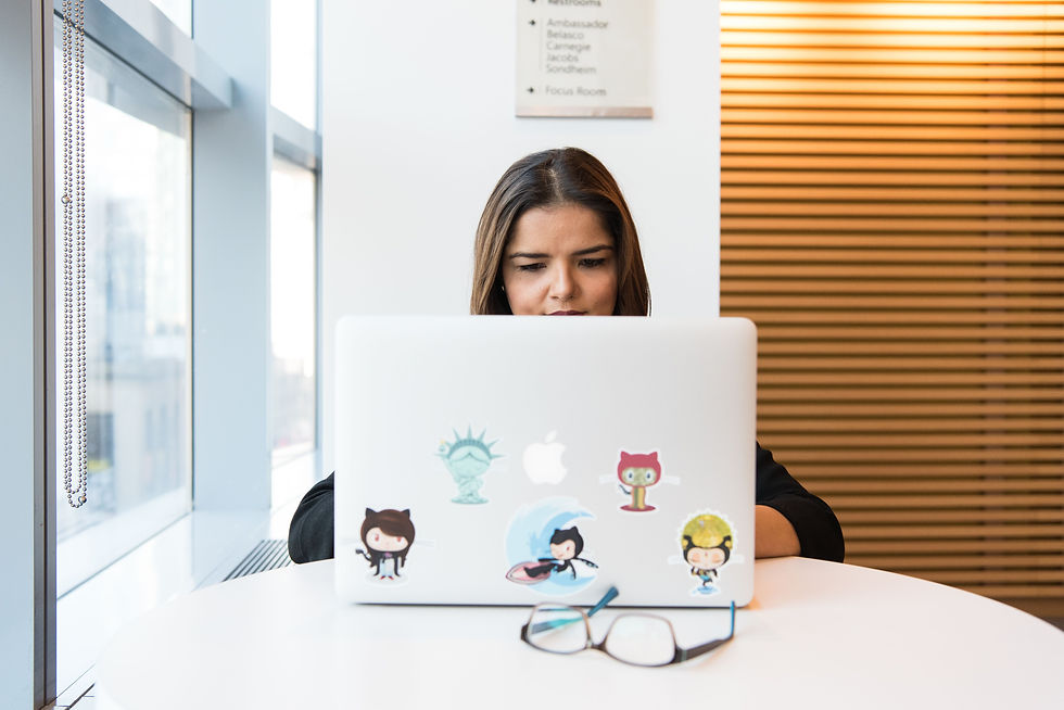 Professional working on a laptop in a modern office for website development and digital marketing