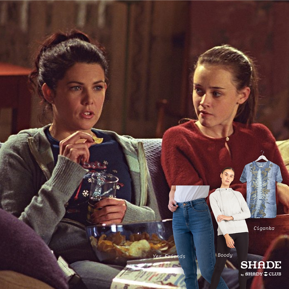 Picture of Rory and Lorelai Gilmore sitting and eating chips in the living room, with SHADE sustainable fashion alternatives in the corner.