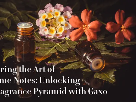 A dark, moody close-up of small amber fragrance bottles surrounded by green leaves and vibrant flowers, symbolizing the natural ingredients and artistry behind Gaxo’s perfume notes.