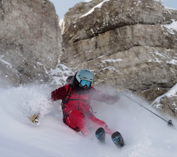 Skier powderskiing in the Dolomites