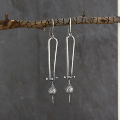 hinged styrax japonica earrings.jpeg