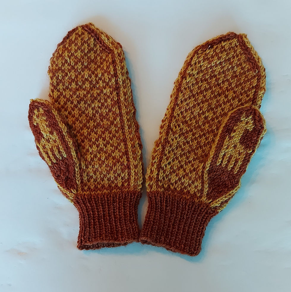palms of giraffe mittens in the snow