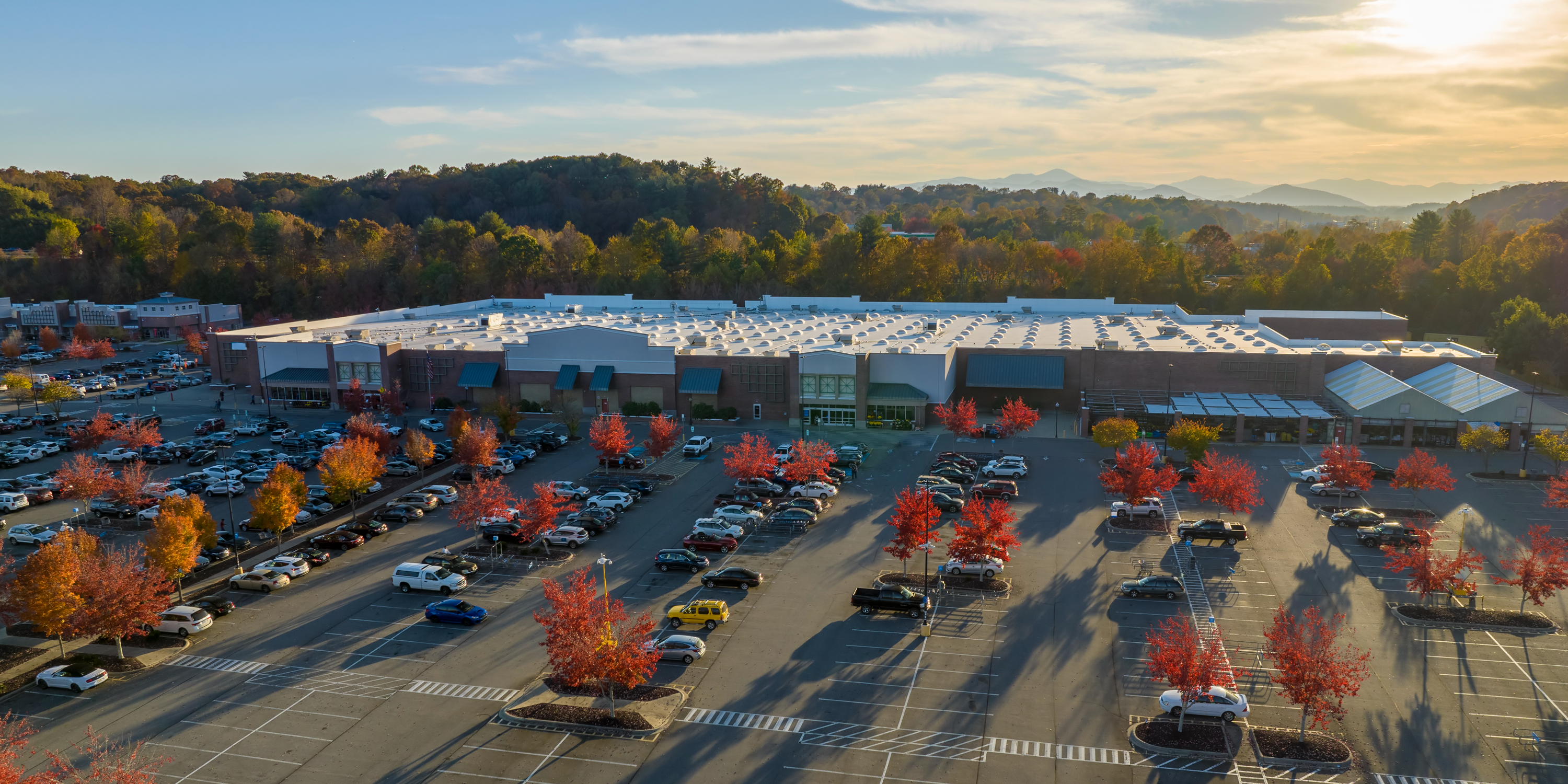 Aerial drone photo of a retail shopping center marketed by Legend Commercial