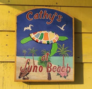 Cathy's at Juno Beach outdoor dining sign with sea turtle