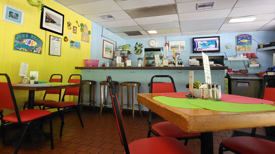 Colorful indoor seating area near the outdoor dining.
