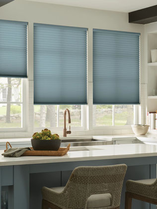 blue grape cellular shades on kitchen windows above sink