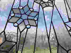 Stained glass snowflake panel by Laura Koss, owner and maker at Garden State Glasswork