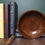 Thumbnail: An antique, brown stained treen bowl, charmingly distressed