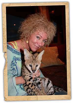 Jennie DeVoe holding a Serval Cat at Tony Stewart's house