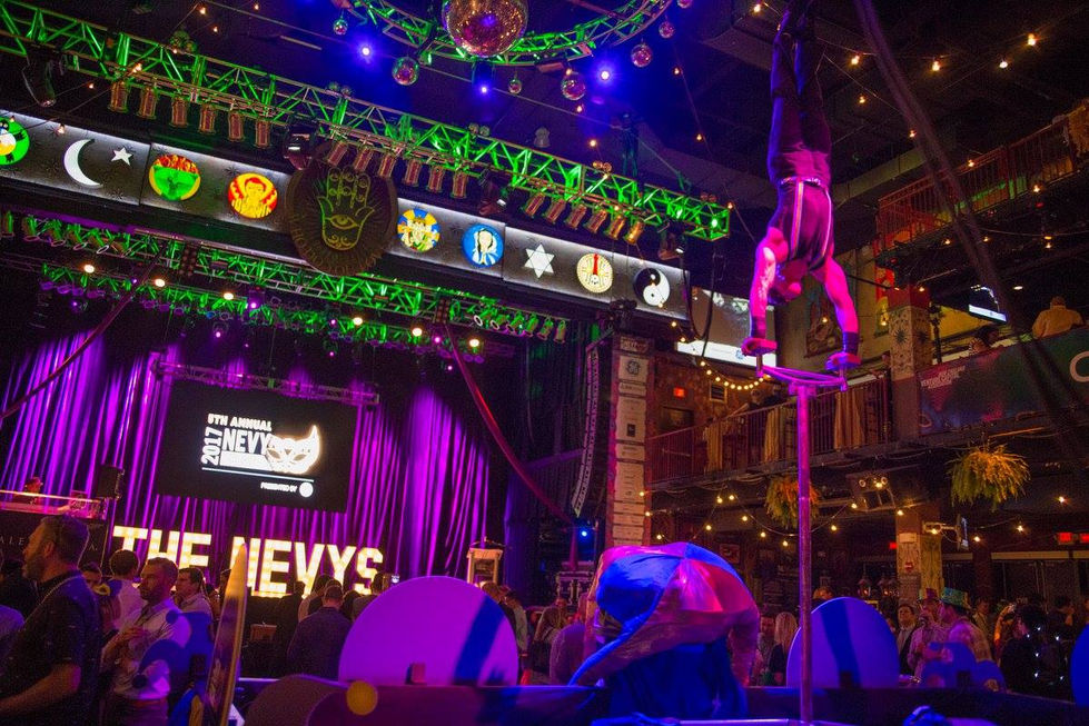 EVYs 2017 stage branding with masquerade theme and event visuals.