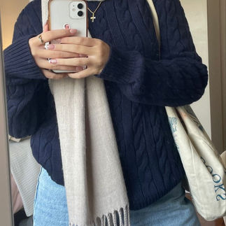 Woman wearing midnight blue sweater