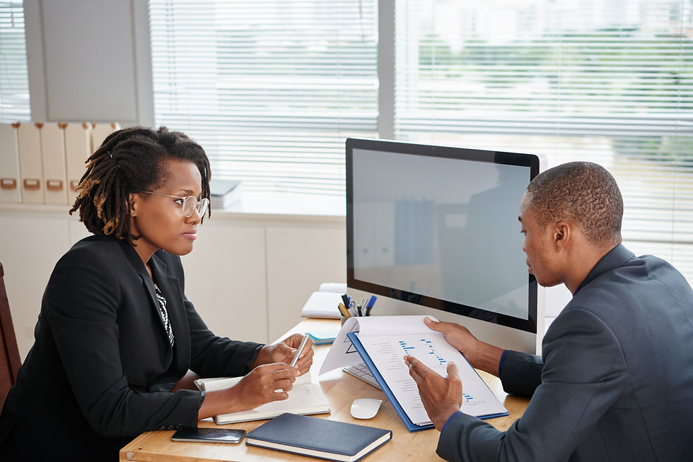 afro-american-man-suit-holding-documents-talking-female-boss.jpg