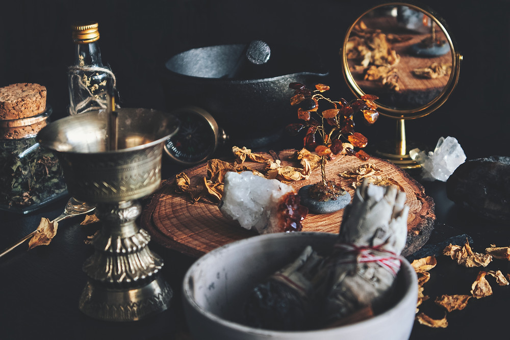 chalice, bowl, herbs, mirror, crystals, sage bundles