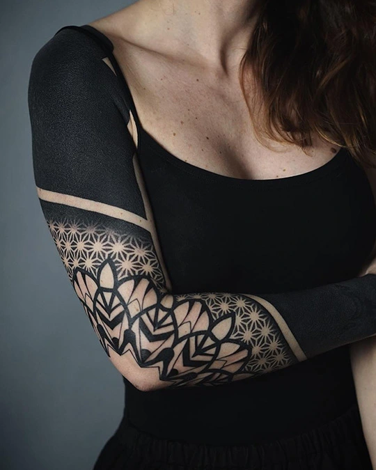 mandala and blackwork tattoo