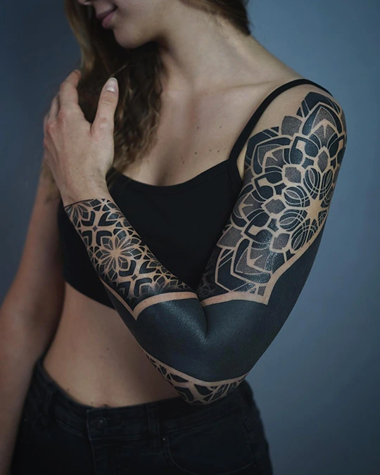 full sleeve mandala and blackwork tattoo