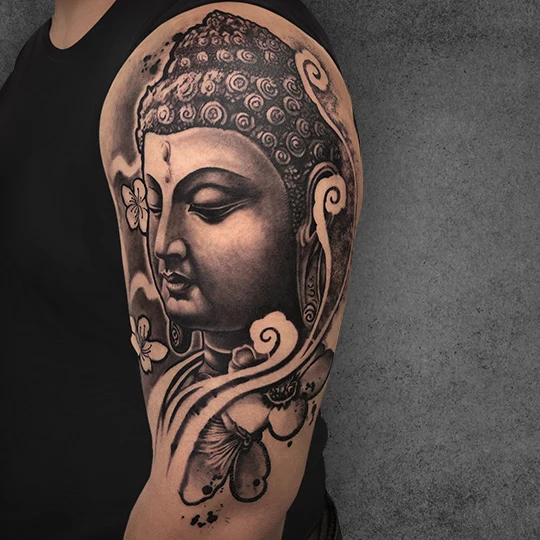 Elegant tattoo with bold traditional motifs by Anamika Dakua at Aliens Tattoo