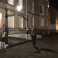 Person outside holding a lamp