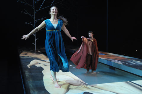 Woman in a halcyon blue dress running