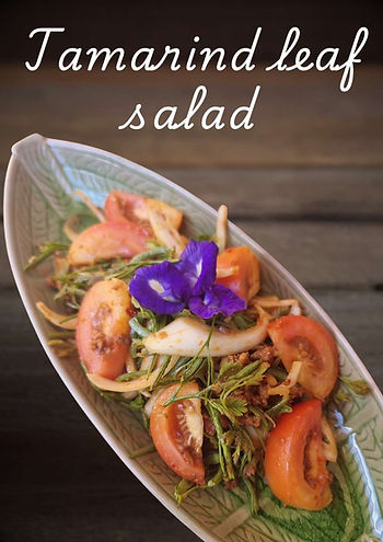Northern Thai tamarind leaf salad Sa yot makham with sautéed chilli paste, tamarind leaves, tomatoes and onions.