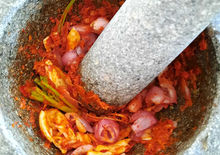 Thai professional cooking course – curry paste preparation with stone mortar and pestle.
