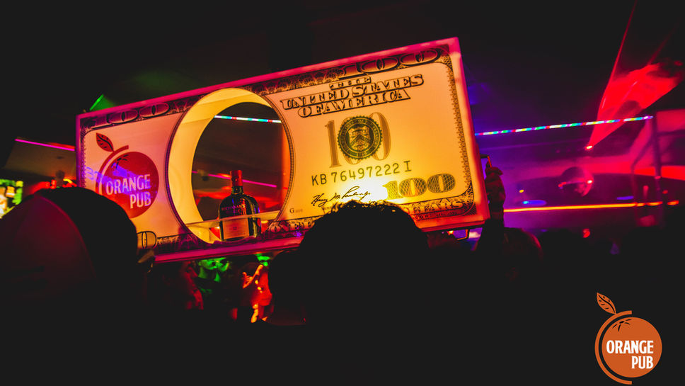 VIP guest bottle service setup at Orange Pub nightclub in Jacó, Costa Rica.