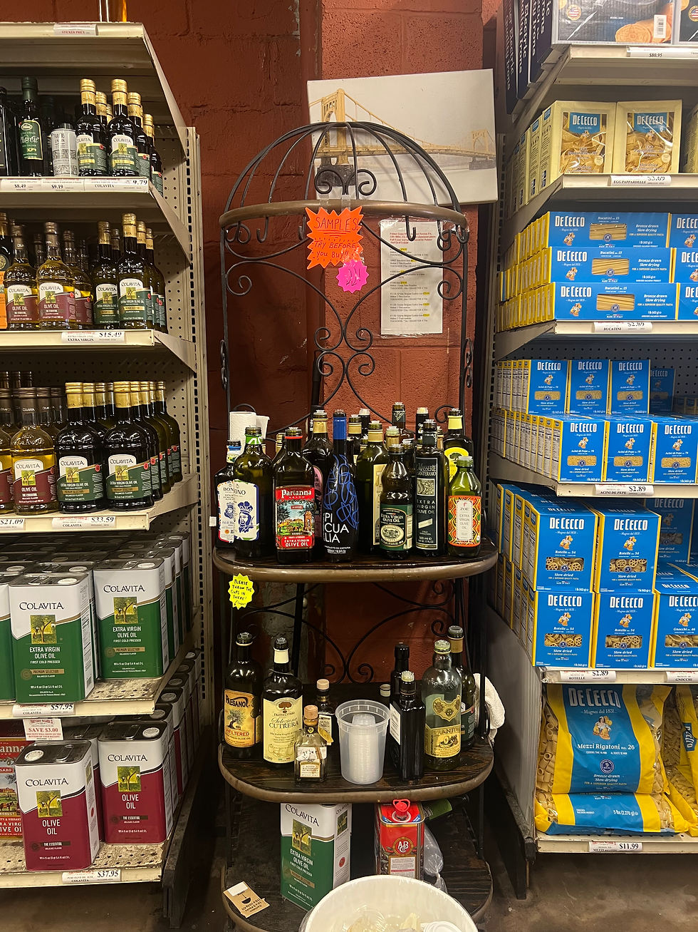 The self-serve olive oil sample stand