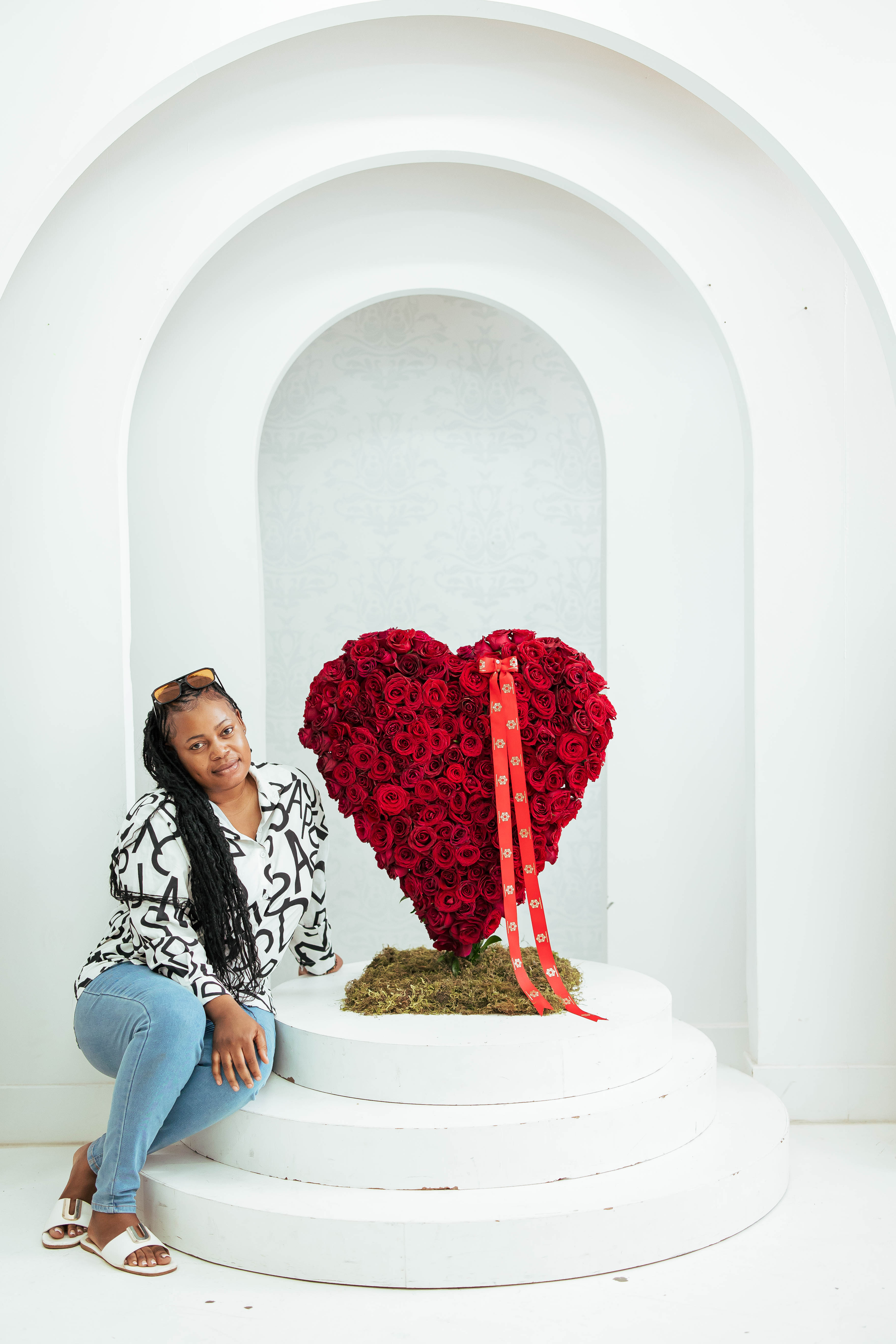team member with floral arrangement