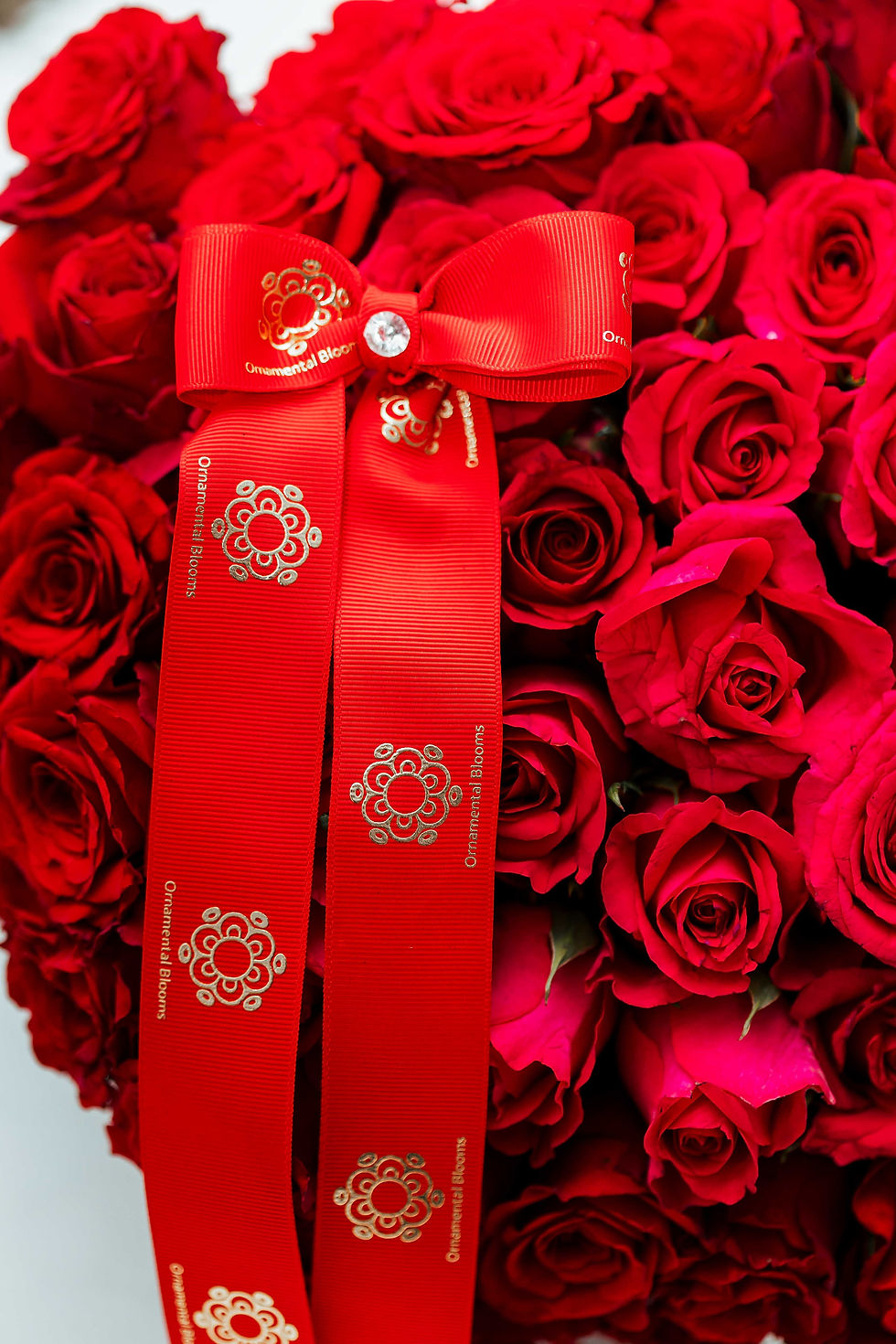 floral arrangement with ornamental blooms logo
