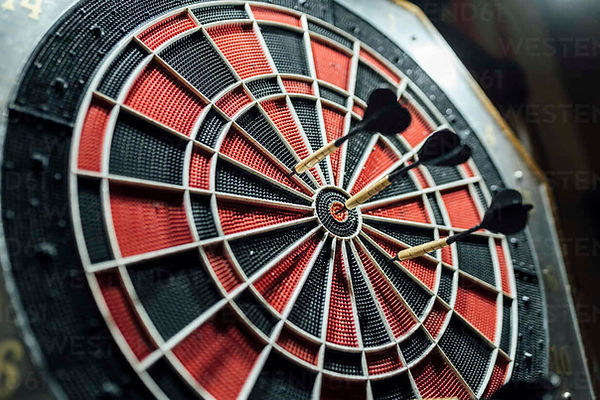 black-and-red-dartboard-with-darts-EGAF01306.jpg