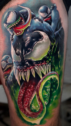Venom tattoo on leg