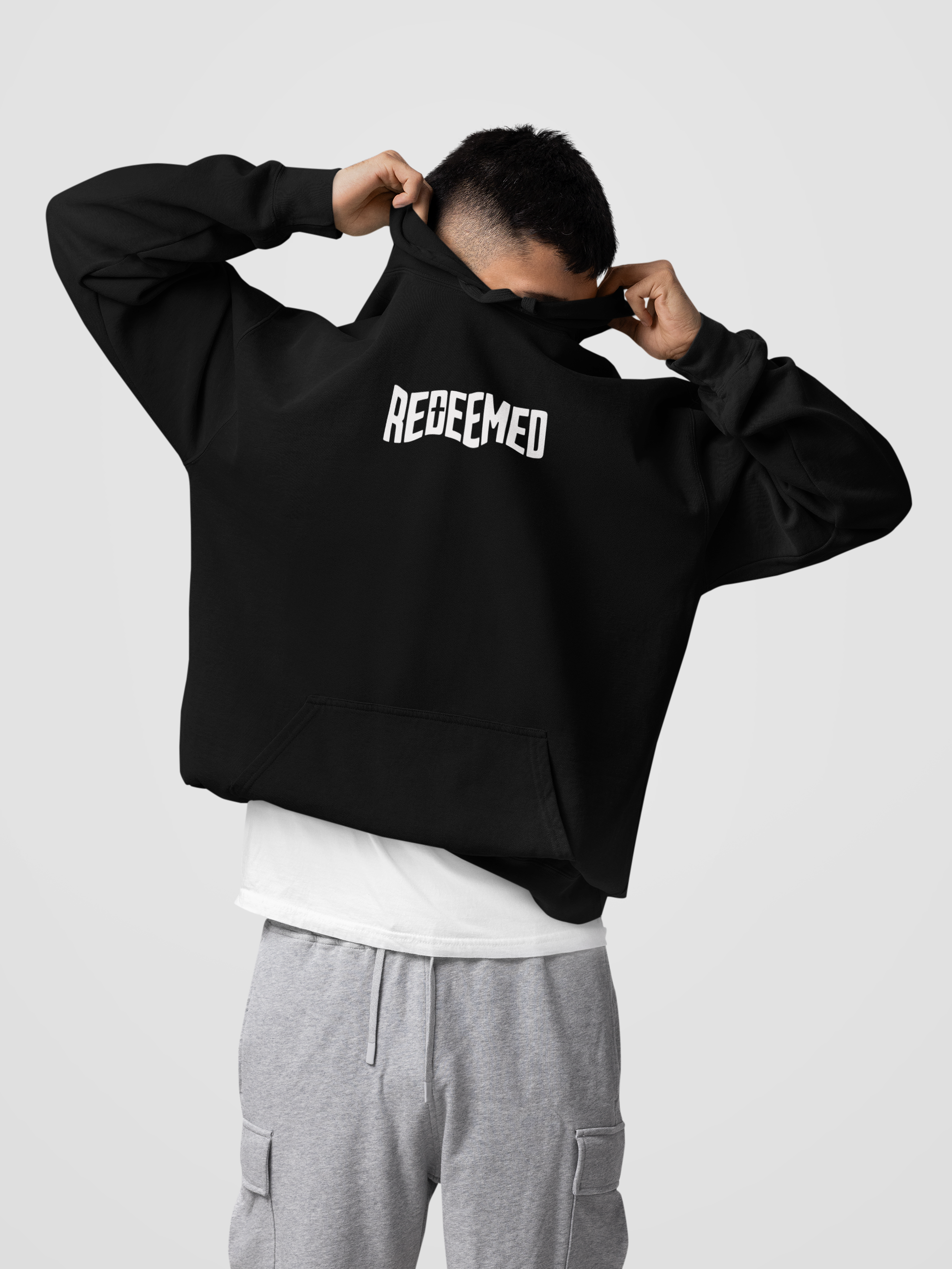comfort-colors-pullover-hoodie-mockup-of-a-man-covering-his-face-in-a-studio-m57420.png