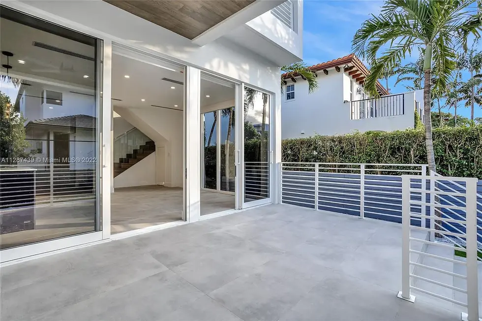 a patio with a sliding glass door that says 2022 on it