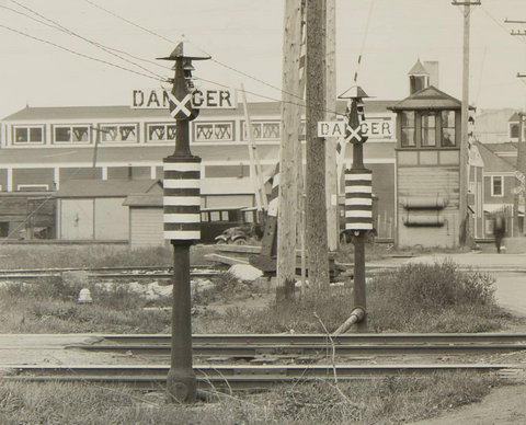 1920s railroad crossbuck at railroad intersection