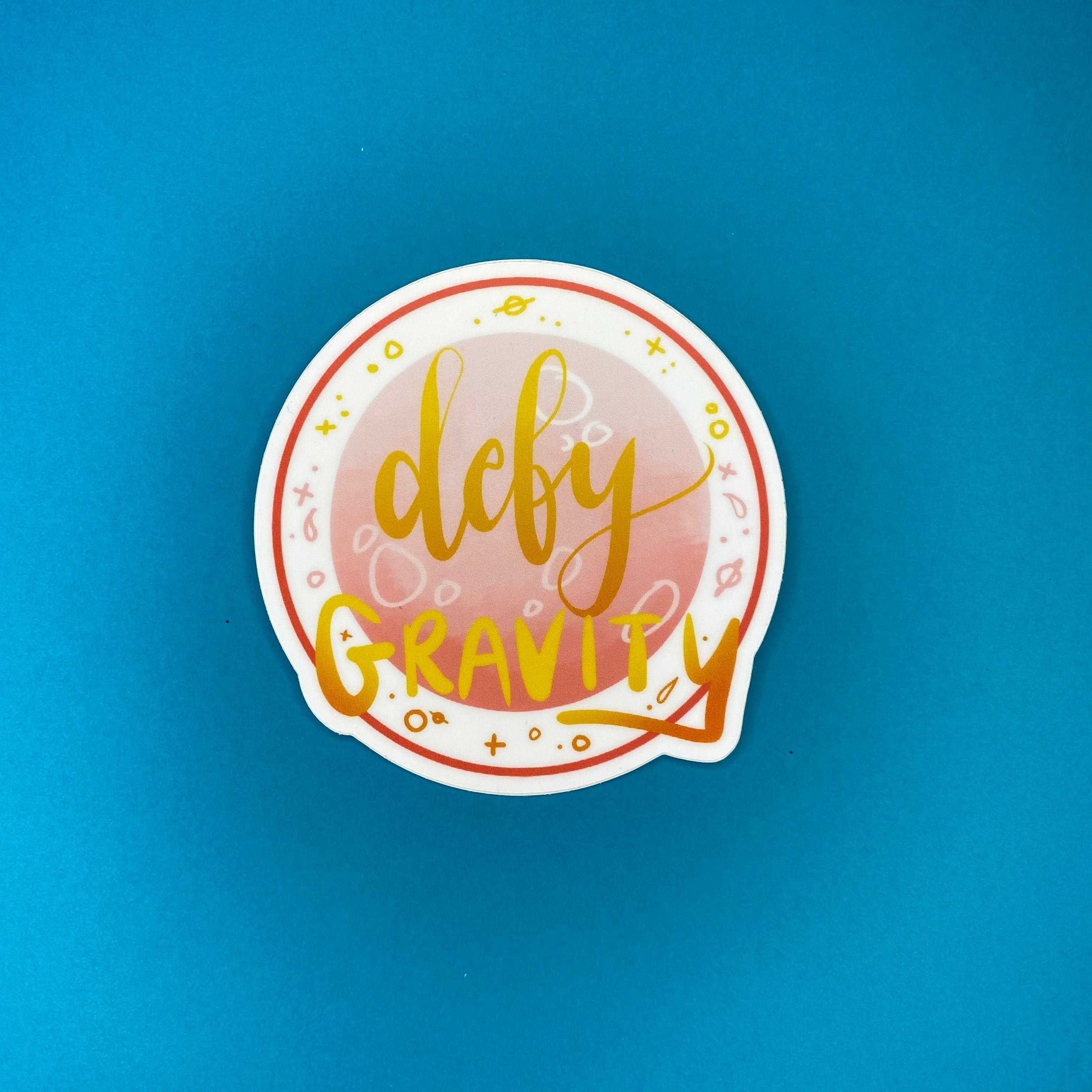 Defy Gravity Sticker