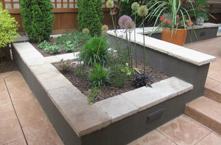 Stucco wall with stone cap.GIF