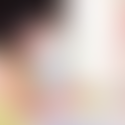 A young child is washing her hands at a sink, holding a bar of soap and focusing carefully on cleaning.