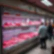 A butcher’s shop in Northern Cyprus displaying high meat prices, with empty shelves and concerned shoppers, symbolising rising TRNC meat prices and declining local consumption.