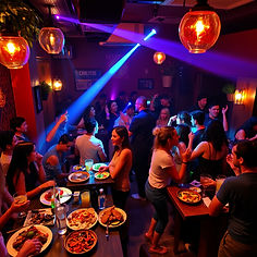 Live band performing at Carlitos Bar with guests dancing and enjoying music