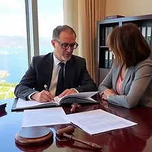Lawyer in North Cyprus advising a client on property and legal matters.
