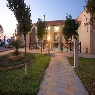 Glaro Garden Hotel lush greenery surrounding outdoor pool and terrace bar.
