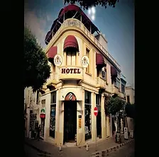 Lord’s Residence boutique hotel facade with modern architecture and poolside area.